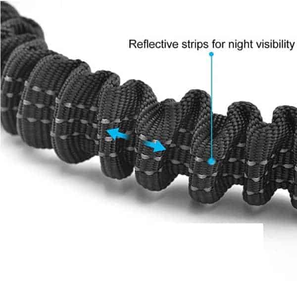 Close up of dog car harness showing reflective strips for nighttime use